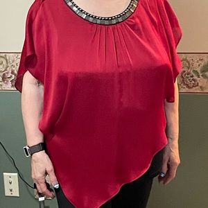 Women’s sleeveless dressy top. Jewel like top Layered red and black.
